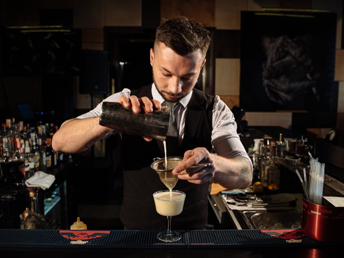 a bartender making a cocktail